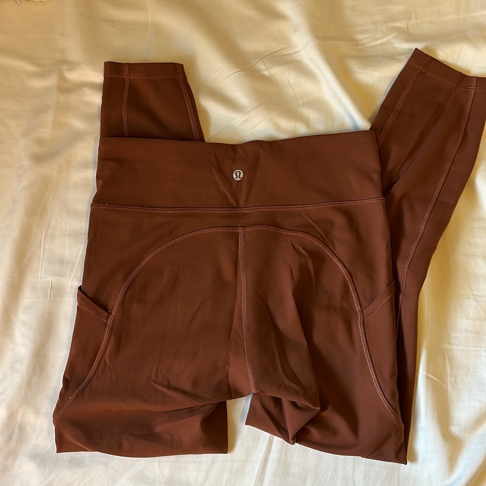 Brown lululemon leggings with side pockets in size 8